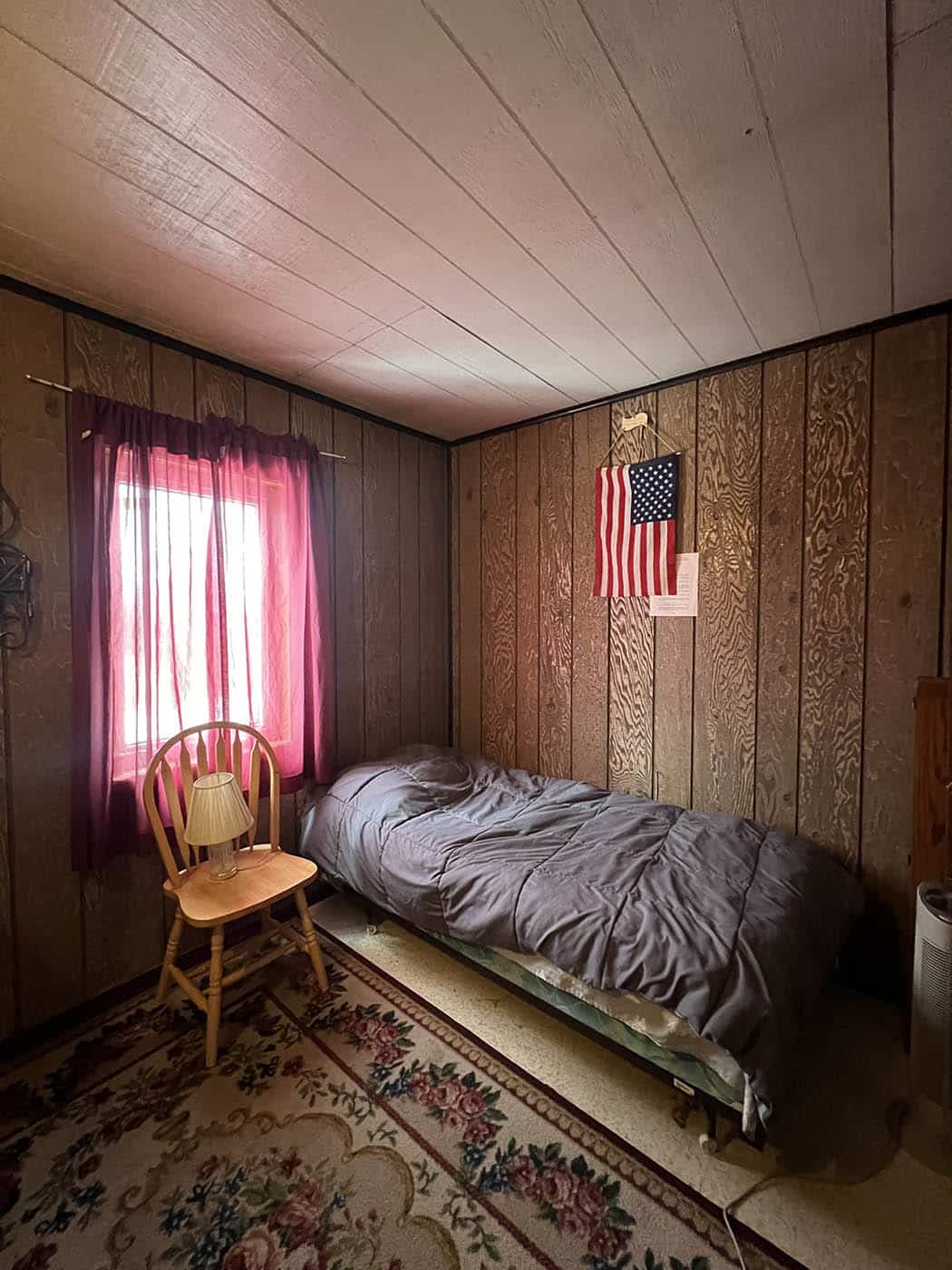 Small bedroom with one bed