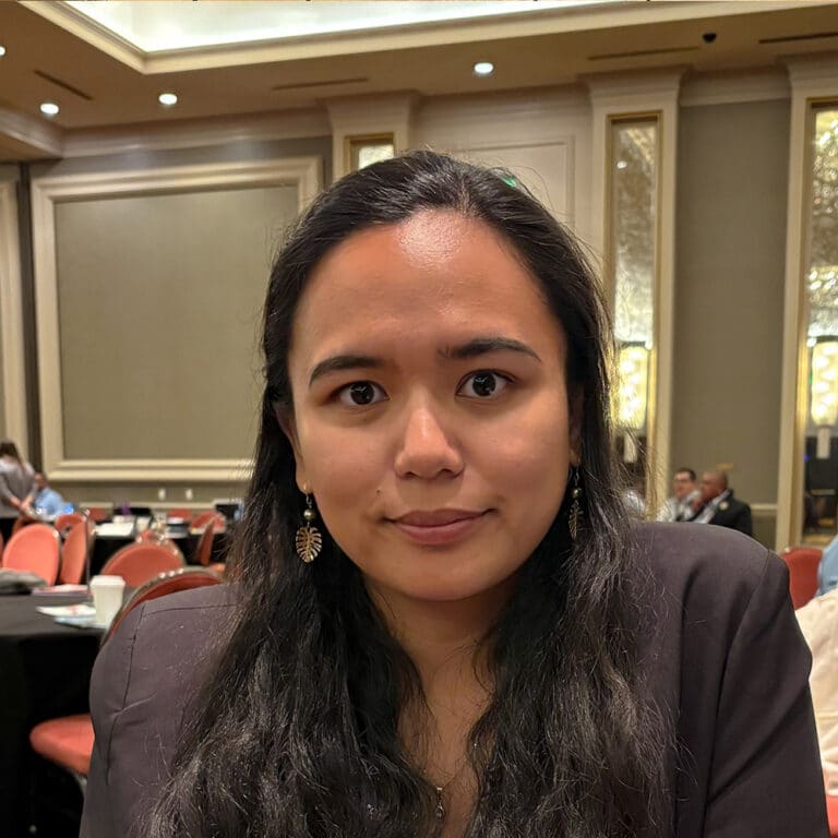 Woman smiling at a conference